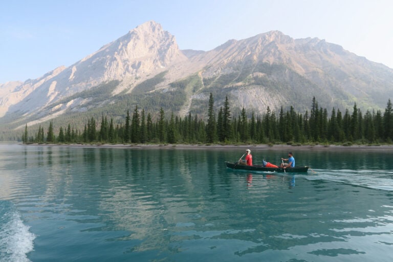 Photo of a lake with canoe