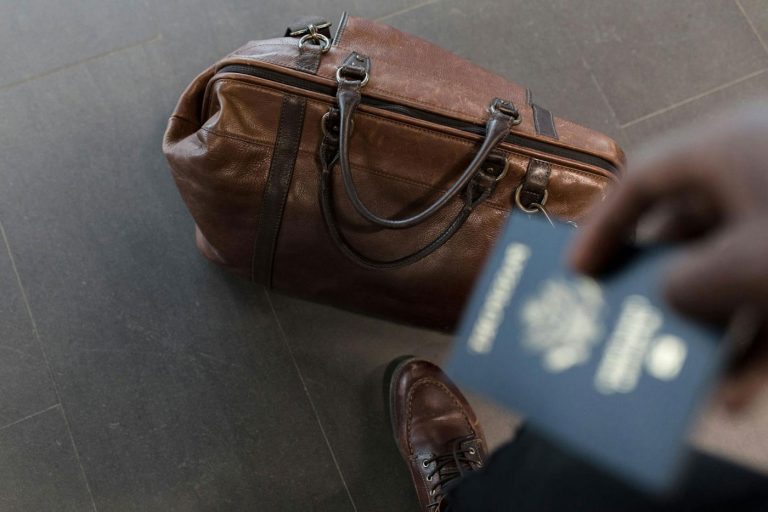 Picture of a bag and a passport for the topic: How to get a second passport