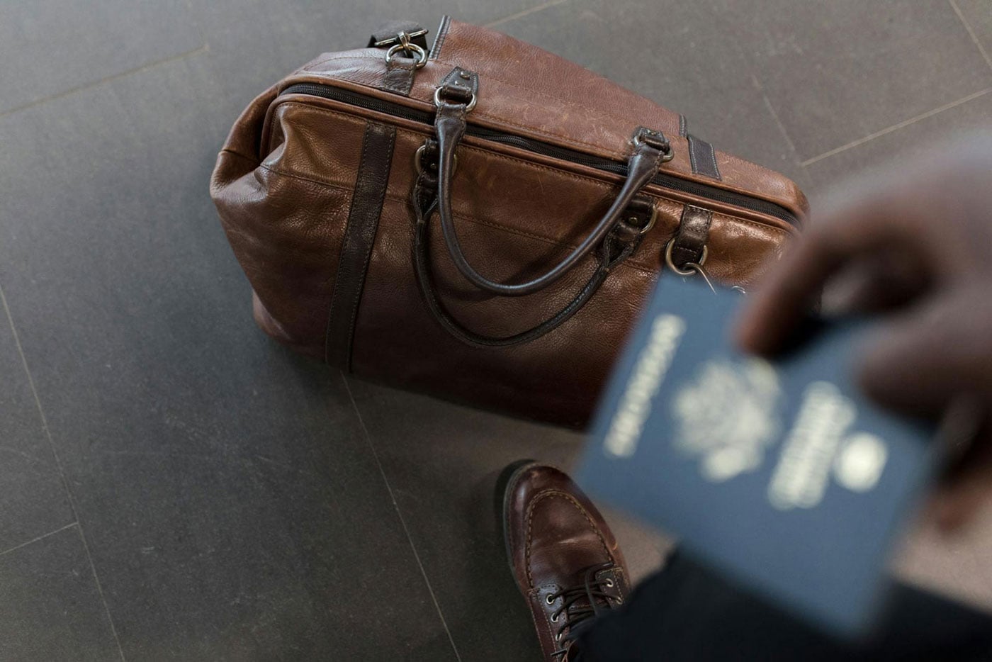 Picture of a bag and a passport for the topic: How to get a second passport